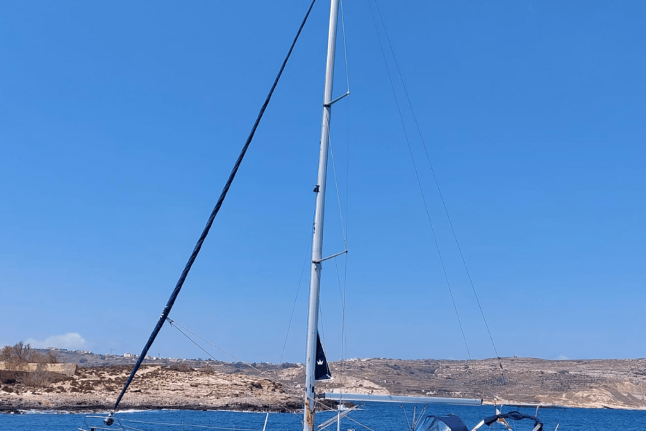 Sailing boat on calm sunny spring waters around Malta